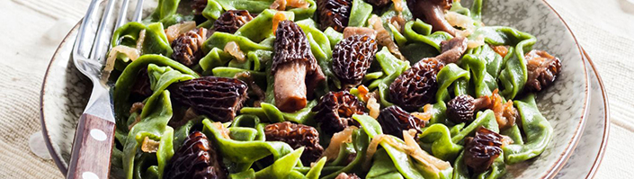 a plate with mushrooms and pasta